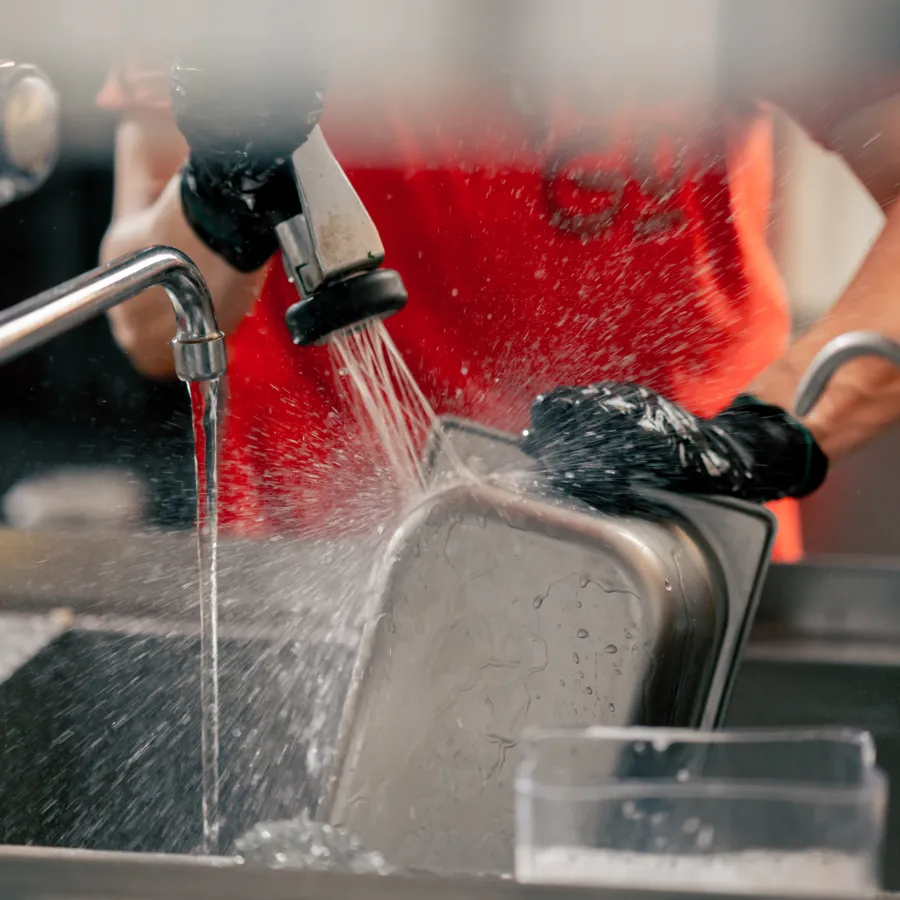 Close up of woman washing dirty dishes in the kitc 2024 03 04 17 52 47 utc